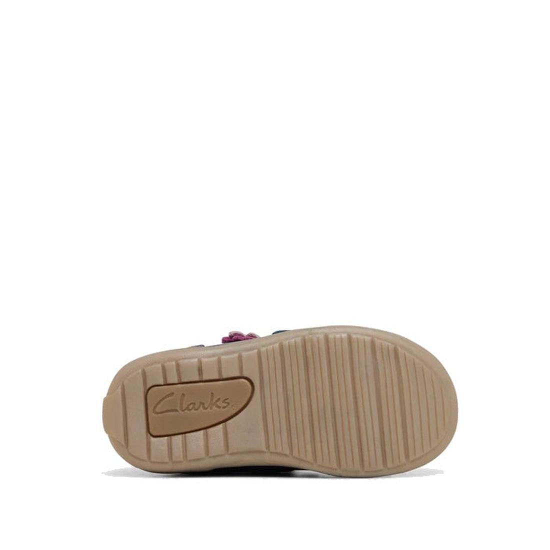 The image shows the bottom sole of the Clarks Kids Manuela Leather Boot in navy, with the Clarks logo embossed on light brown textured rubber for traction. The boot’s comfortable design stands out against a white background., 36288, 9336078980168, 9336078