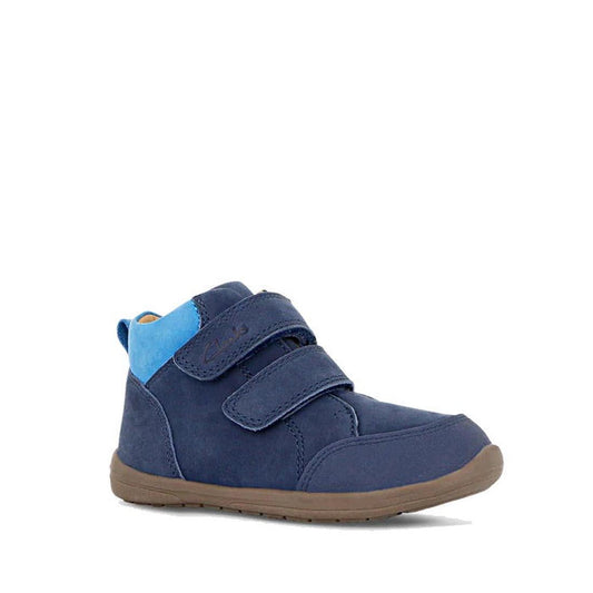 The Clarks Kids Max Leather Boot Navy is a navy blue leather toddler shoe with two Velcro straps, a brown rubber sole, and a bright blue heel accent, shown on a white background. Designed for comfort and everyday wear.