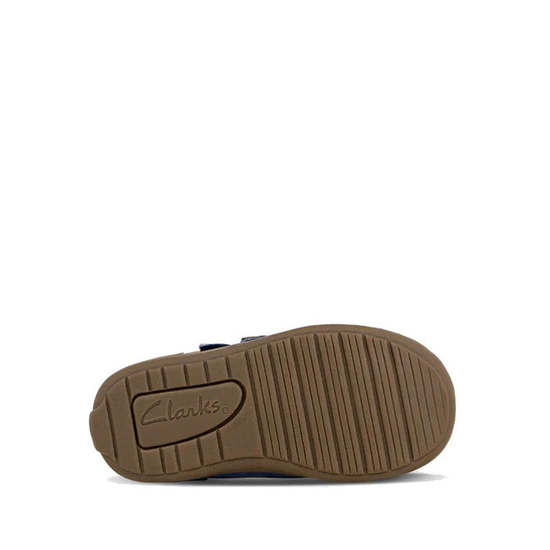 The image displays the sole of a Clarks Kids Max Leather Boot in navy. The brown sole has horizontal grooves for traction and features the Clarks logo near the heel, shown from the bottom against a white background., 36311, 9336078984241, 9336078984265, 9
