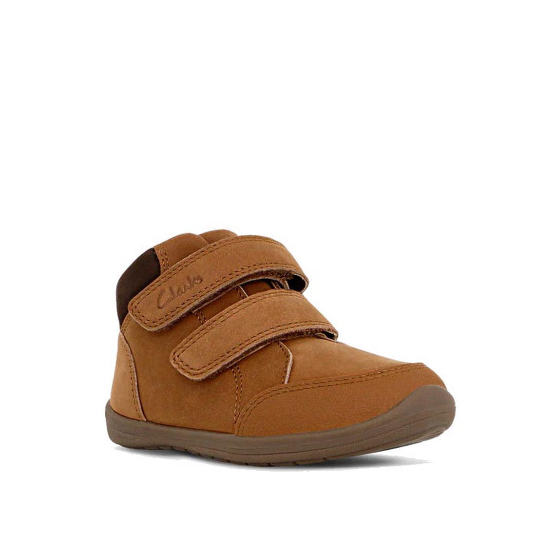 The Clarks Kids Max Leather Boot Tan is a children's brown leather shoe featuring two Velcro straps for a secure fit, a rubber sole with a slight heel, rounded toe for comfort, and the Clarks logo on the top strap.