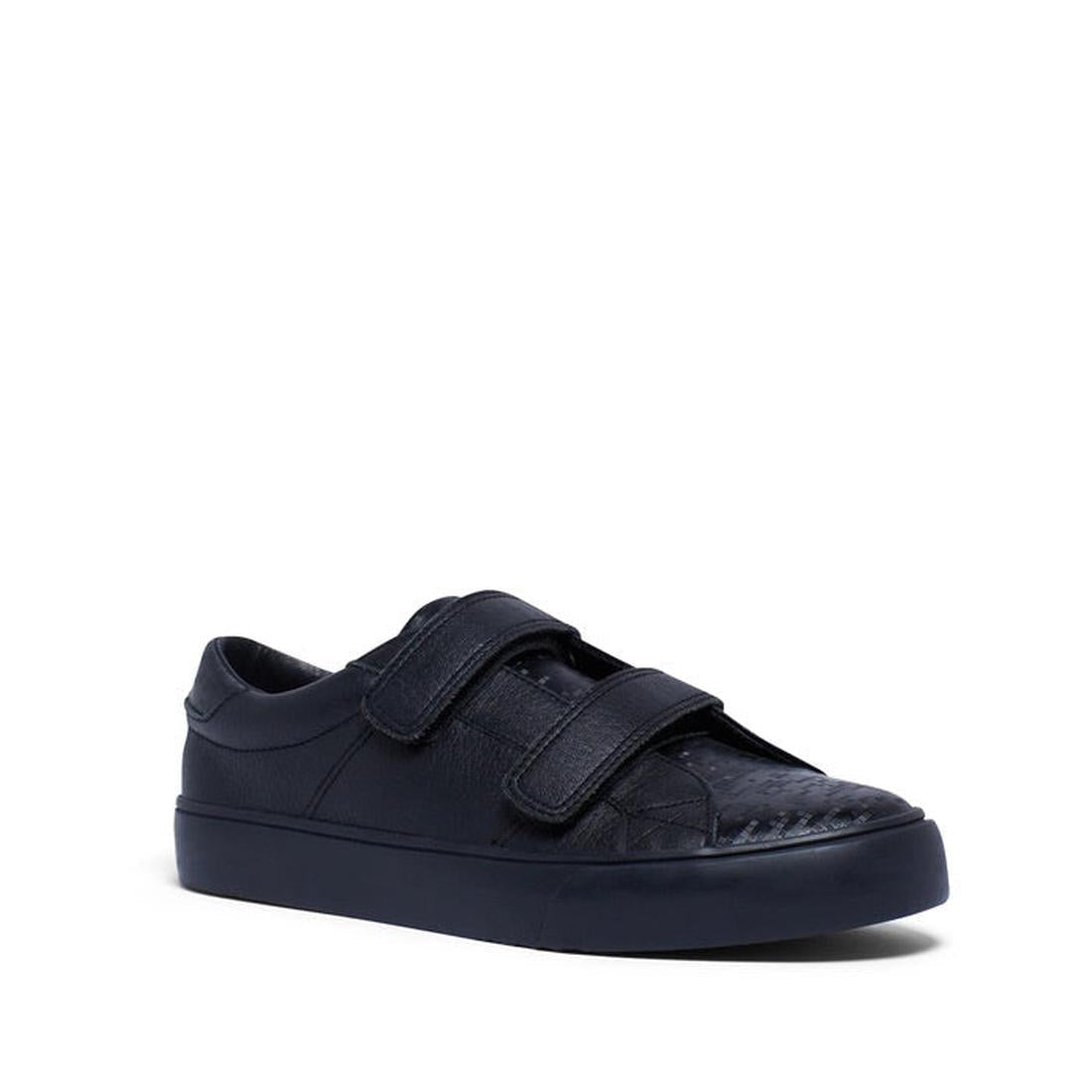 Clarks Survivor Strap Kids Black School Shoe—leather, low-top with sturdy sole, double Velcro closure, size UK10 on white background.  ksnz