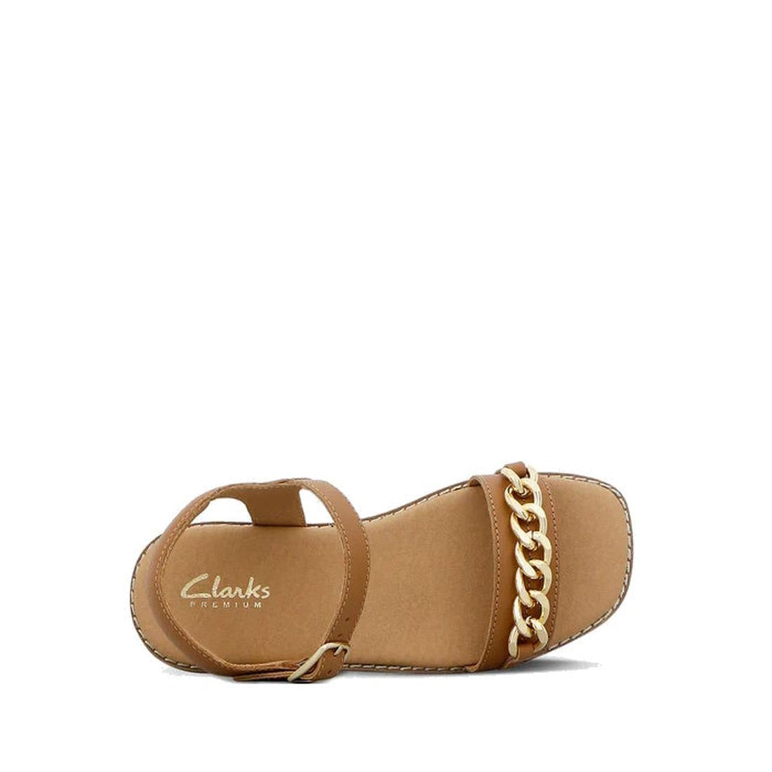 The Clarks Girls Amy Tan Leather Sandal Special Occasion features an adjustable ankle strap and a bold gold chain across the toe. Displayed on a white background, these stylish leather sandals are perfect for any fashionable girl., 40498, 40499, 40500, 40