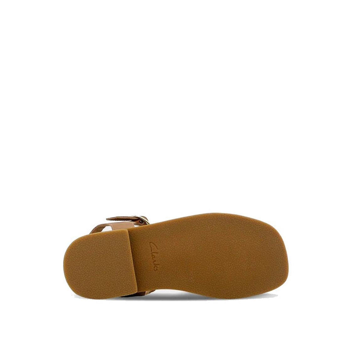 The Clarks Girls Amy Tan Leather Sandal Special Occasion is shown from the bottom, revealing a flat, textured sole with minimal tread and the Clarks brand name embossed near the heel., 40498, 40499, 40500, 40501, 40502, 40503, 9336078207838, 9336078207852