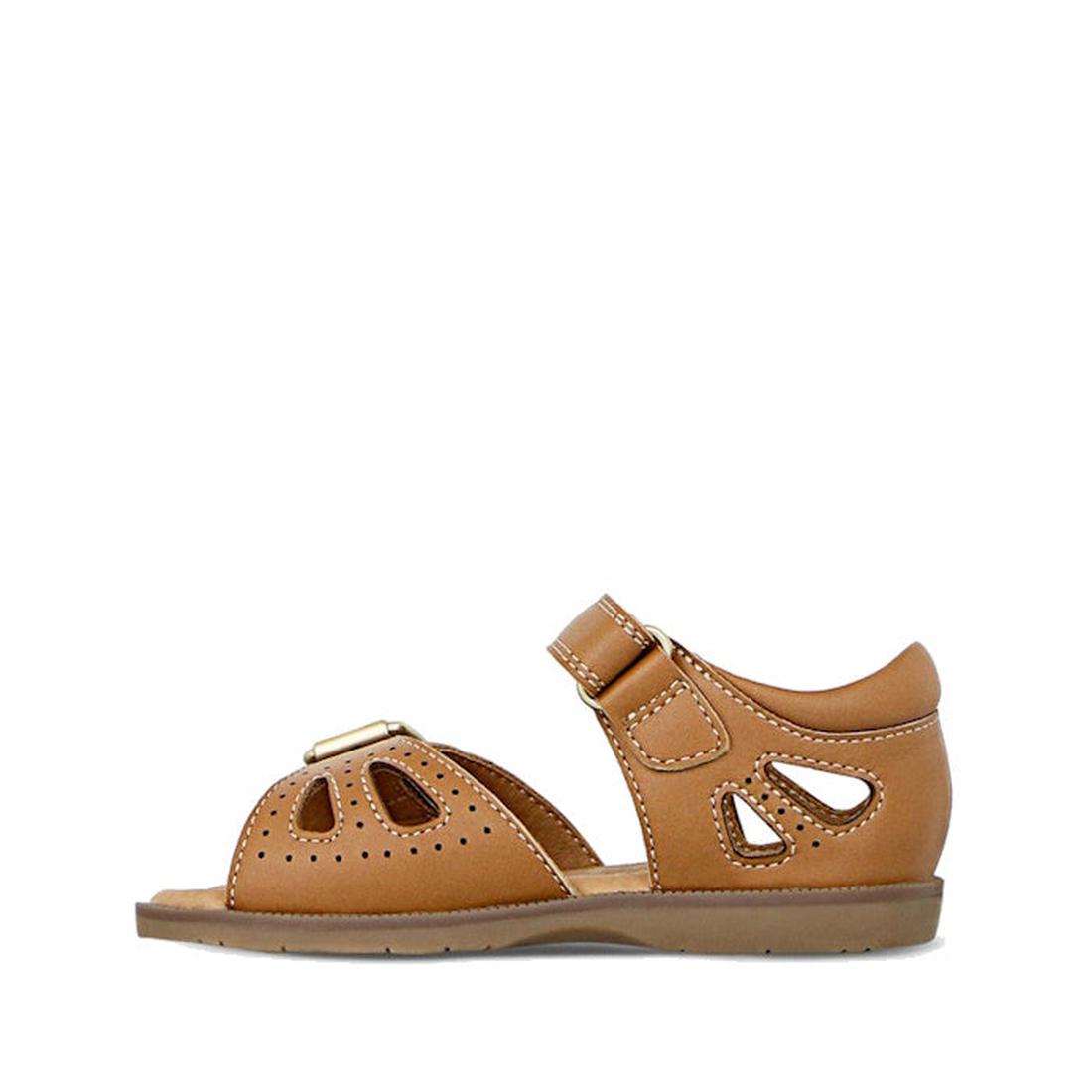 The Clarks Carrie Tan Leather Girls Sandal features cutout details, a closed heel, adjustable ankle strap, white stitching, and a flat rubber sole for all-day comfort and durability., 9336078210852, 9336078210890, 9336078210937, 9336078210975, 93360782110