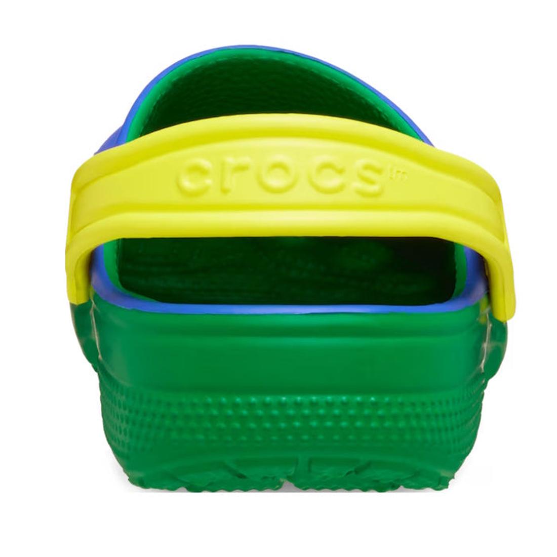A close-up rear view of Crocs Kids Youths Retro Sport Classic Clog Sandals in blue, green, and yellow, featuring a bright color block design and a yellow heel strap embossed with “CROCS.”., 198445214431, 198445214448, 198445214455, 198445214462, 198445214