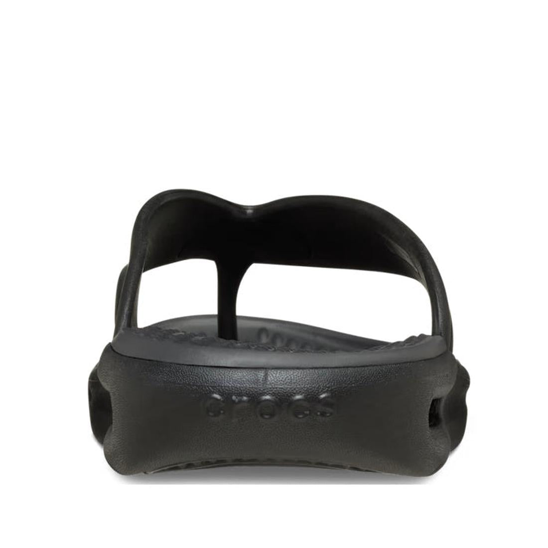 Front view of a single Crocs - Mens In Motion Flip Flop Jandal in black/grey, showing the open toe, contoured LiteRide foam footbed, and embossed Crocs branding on the front sole., 48783, 198445177620, 198445177637, 198445177576, 198445177583, 19844517759