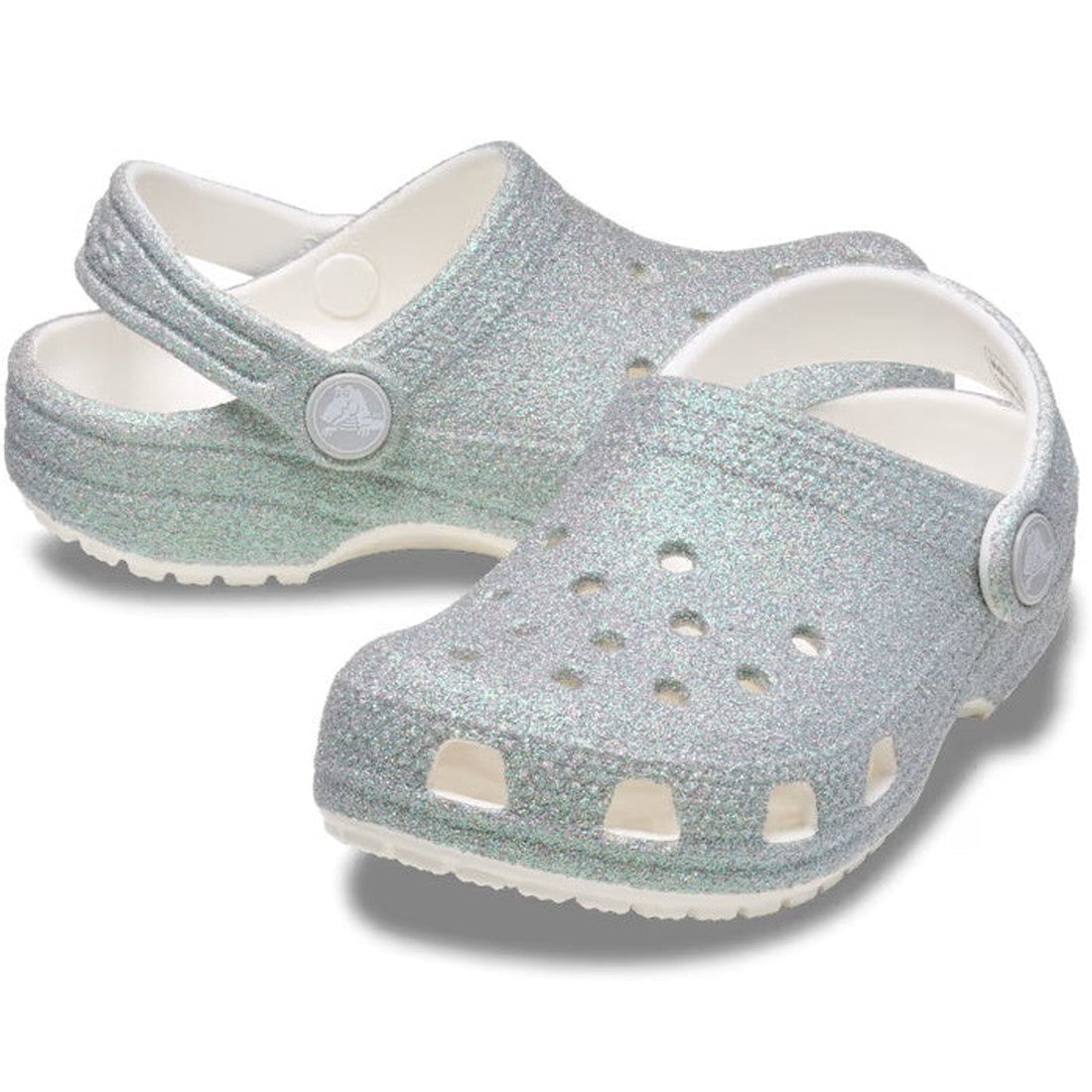 Crocs Kids - Classic Iridescent Glitter Clog White brings silver sparkle, a comfy white sole, and secure heel straps for growing kids.  ksnz