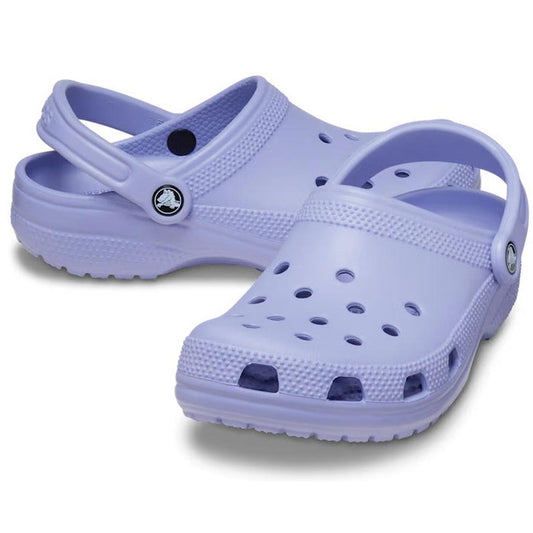 A pair of Crocs - Classic Clog Mystic Purple Adults womens & mens with ventilation holes and heel straps, displayed on a white background.