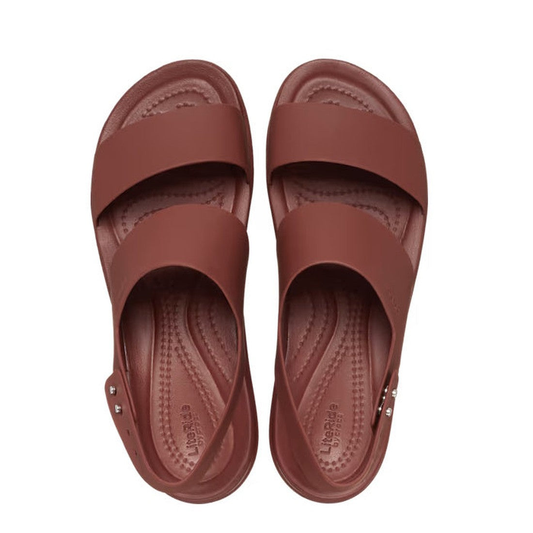 A pair of Crocs Sandal Wedge Dark Clay Red Brooklyn Low with wide crisscross straps and textured insoles, shown from above on a white background., 196265860074, 196265860081, 196265860098, 196265860012, 196265860050, 196265860067, 196265860029