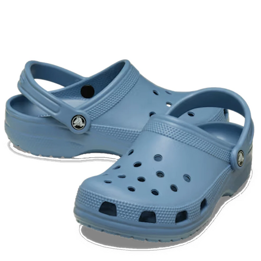 A pair of Crocs Classic Clog Astro Blue Adults Unisex, designed for comfort with ventilation holes and a pivoting heel strap, displayed against a white background.