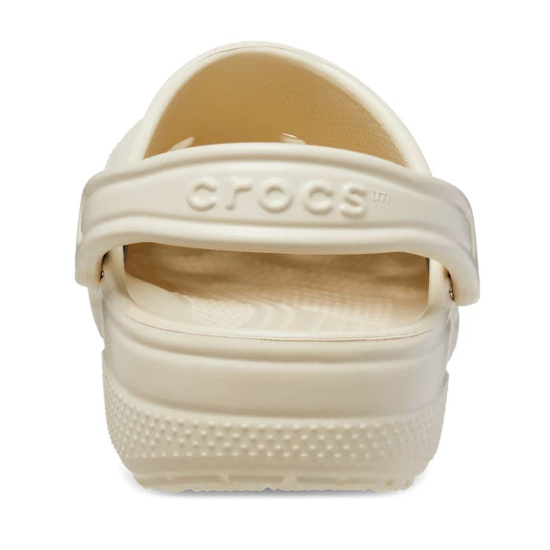 A close-up rear view of a single Crocs - Classic Clog in Bone Off White shows the heel strap with CROCS embossed and textured details—iconic, lightweight adult footwear. Now on clearance., 196265131990, 196265132003, 196265132010, 196265132027, 1962651320