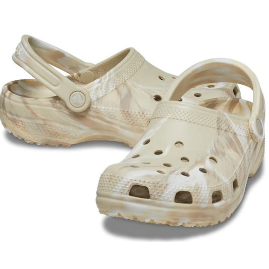 The Crocs - Classic Marbled Clog Bone Off White Multi Adults features a beige and white marbled design, ventilation holes, a pivoting heel strap, and Iconic Crocs Comfort, shown against a white background.