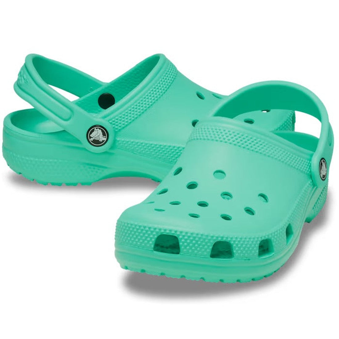 A pair of Crocs Kids Toddlers Classic Clog in Lagoon Green, toddler sizes, featuring perforated tops and adjustable heel straps, displayed on a white background.