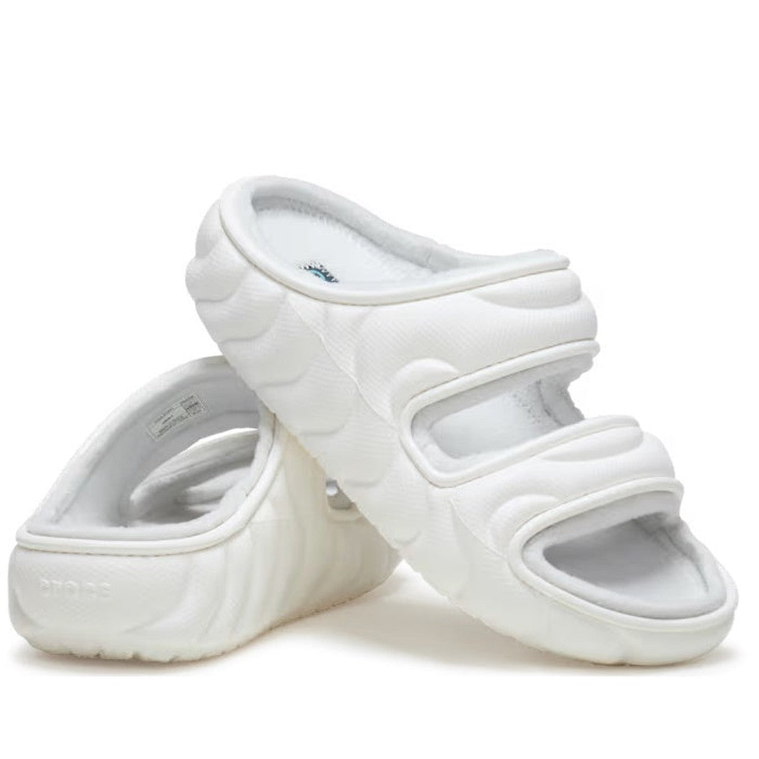 Crocs Classic Cozzzy Overpuff Puffer Sandal Slide in white, with plush wide straps and cushy thick sole, one sandal atop the other.  ksnz