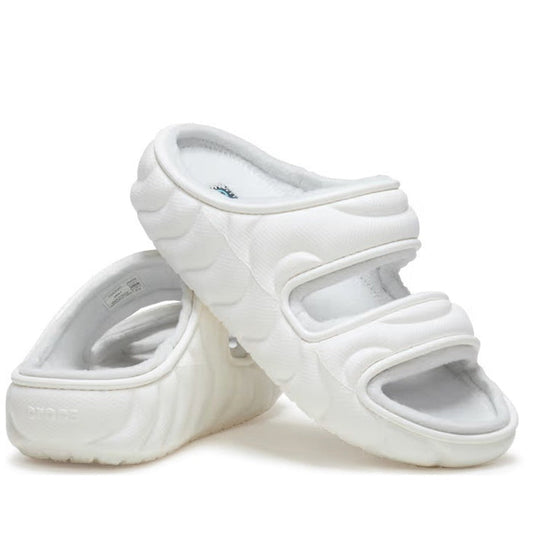 Crocs Classic Cozzzy Overpuff Puffer Sandal Slide in white, with plush wide straps and cushy thick sole, one sandal atop the other.  ksnz