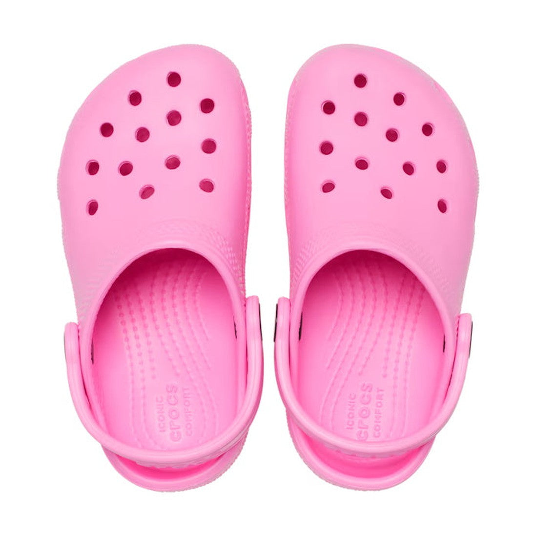 A pair of Crocs Kids Youths - Classic Clog K Taffy Pink with ventilation holes and adjustable heel straps, viewed from above on a white background; water-friendly and ideal for everyday adventures., 191448893788, 191448893795, 191448893801, 191448893818, 