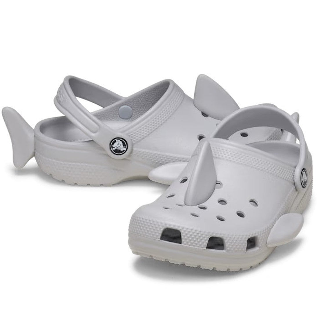 Crocs Kids Fun Lab I Am Shark clogs: white slip-ons with fun shark fins, comfy cushioned sole, breathable holes, and secure heel strap.  ksnz