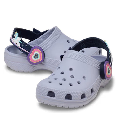 Crocs Kids Toddlers Clog C Imagination Lights Backstrap in Frosted Grape offers easy slip-on comfort, light-up soles, and a playful unicorn charm.  ksnz