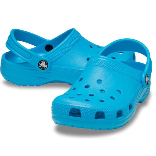 A pair of Crocs Kids - Classic Clog in Venetian Blue, featuring ventilation holes and adjustable heel straps, water-friendly and available in junior youth sizes, displayed on a white background.
