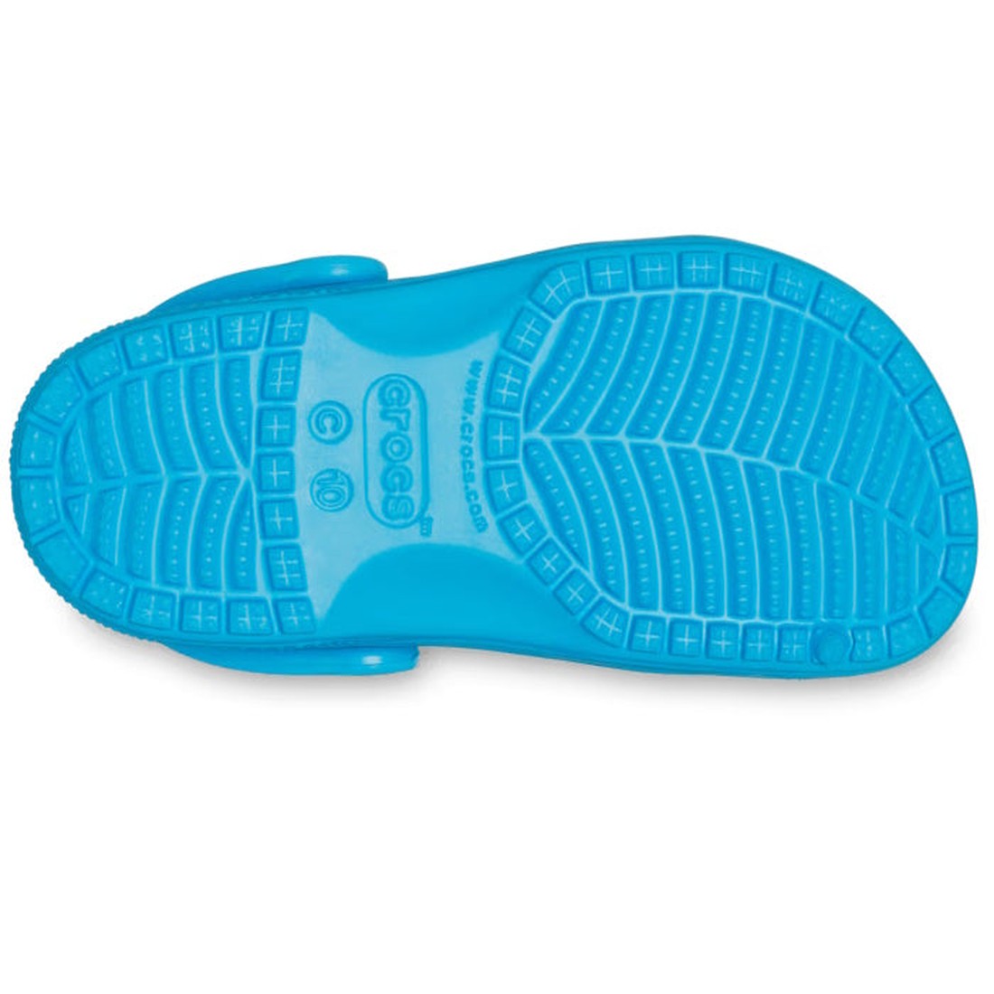 The image shows the bottom view of a Crocs Kids Classic Clog in Venetian Blue for junior youths, featuring a textured sole with grooves, lines, and cross-shaped treads for grip. The water-friendly design is ideal for kids., 196265746941, 196265746958, 196