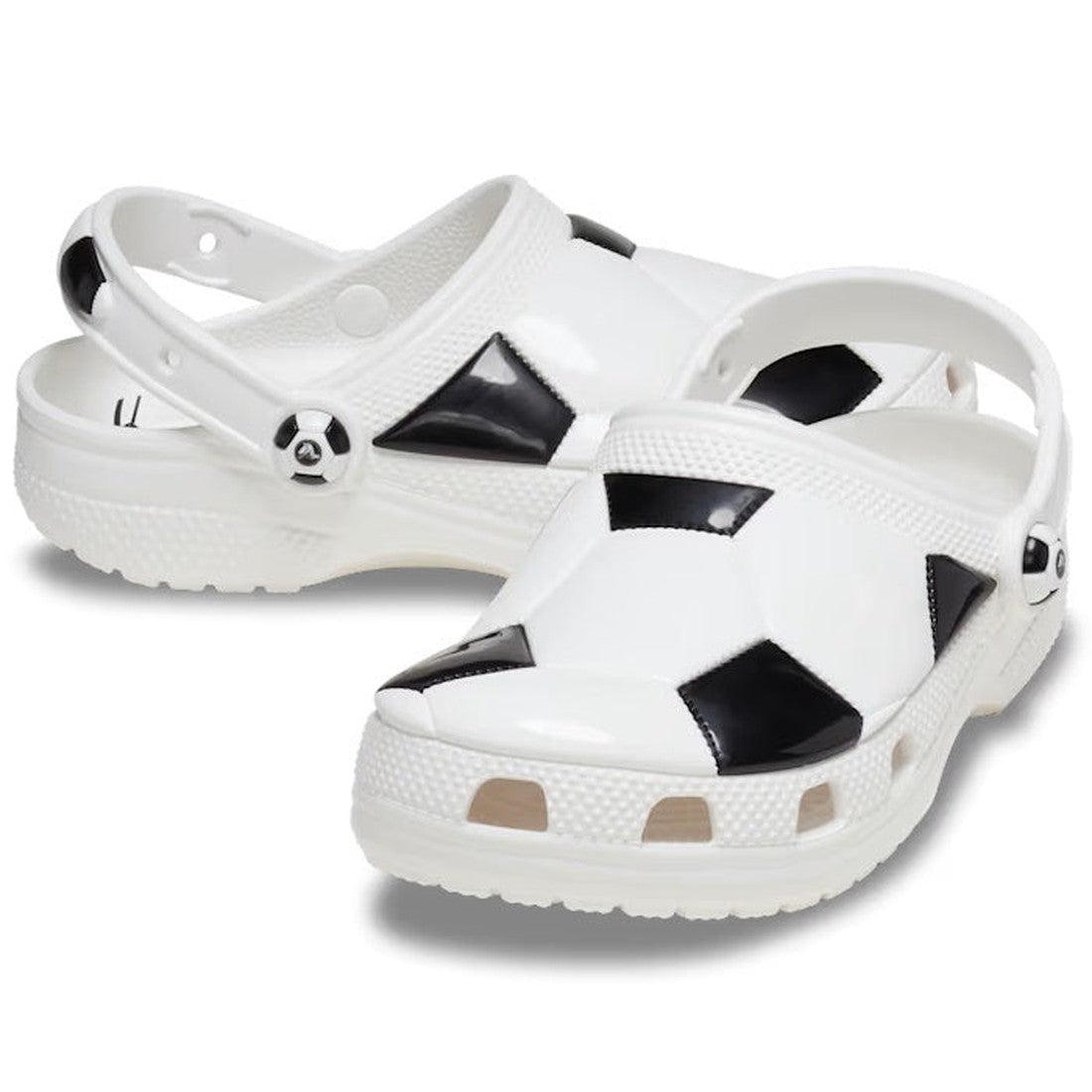 Crocs Kids - Youths Soccer Classic Clog K in white/black has a fun soccer pattern, comfy slip-on style, sturdy sole, and secure back strap.  ksnz