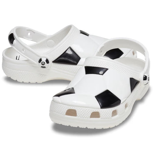 Crocs Kids - Youths Soccer Classic Clog K in white/black has a fun soccer pattern, comfy slip-on style, sturdy sole, and secure back strap.  ksnz