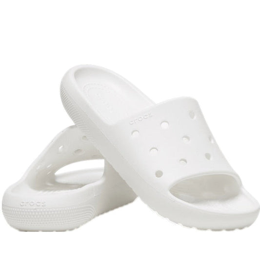 Crocs Classic Slide V2 White sandals for adults, with comfy slip-on style, soft white sole, open-toe design, and fun vent holes.  ksnz