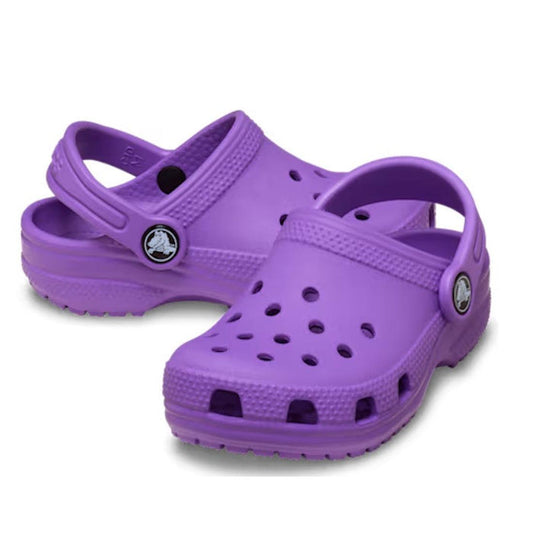A pair of Crocs Kids Toddlers Classic Clog Purple shoes in toddler sizes, featuring ventilation holes and adjustable heel straps, displayed on a white background.