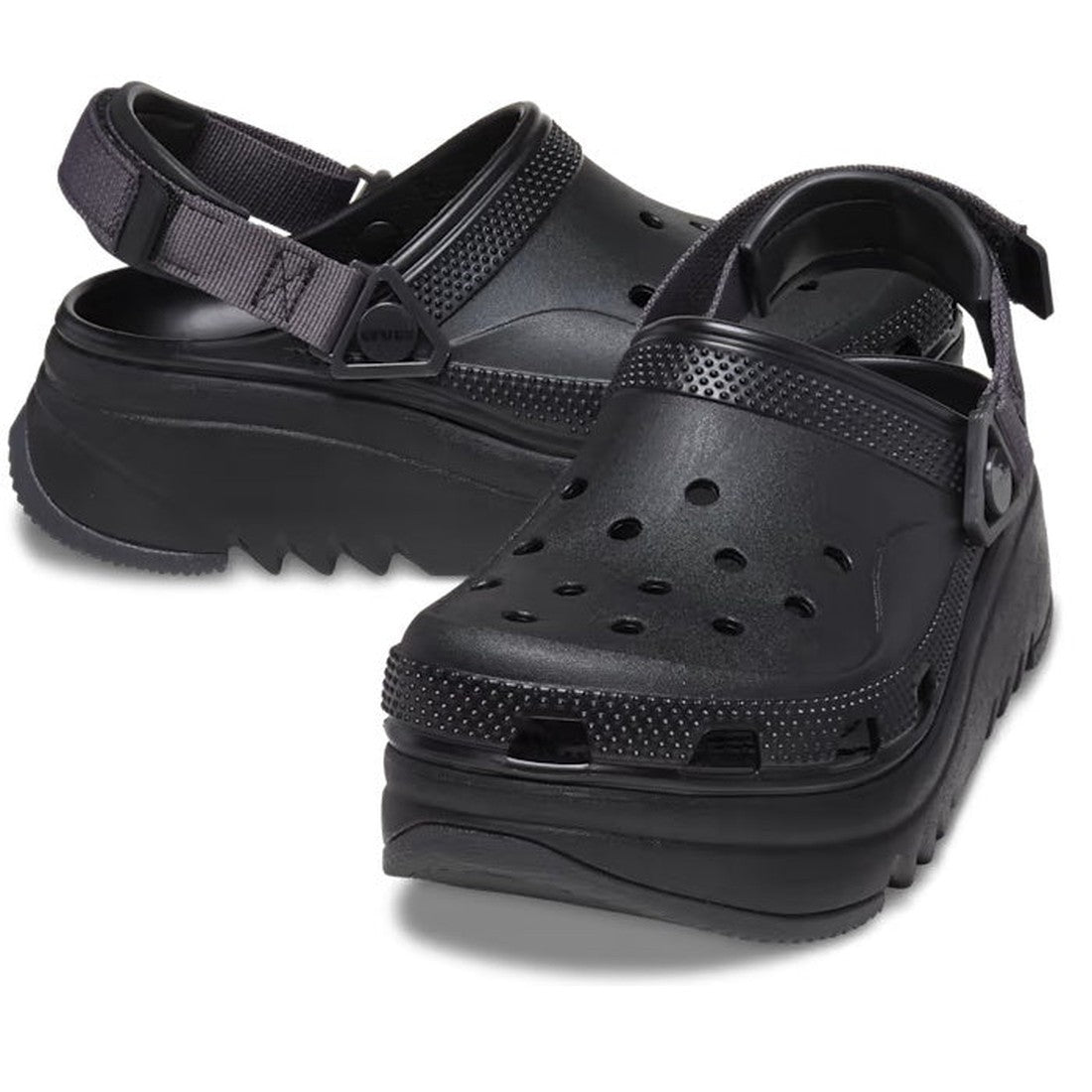 The Crocs Hiker Xscape Clog Adults Black Platform features perforated uppers, adjustable heel straps, and thick, ridged soles for a bold upgrade on classic black Crocs.
