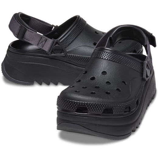 The Crocs Hiker Xscape Clog Adults Black Platform features perforated uppers, adjustable heel straps, and thick, ridged soles for a bold upgrade on classic black Crocs.