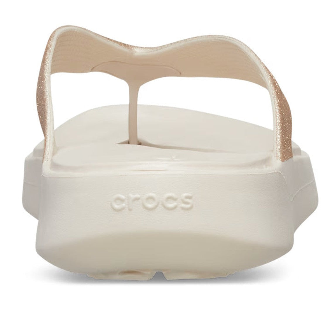 A close-up rear view of a single off-white Crocs - Womens Getaway Glitter Strappy Flip Flop Sandal in Stucco, featuring a thong strap and "crocs" embossed on the back, designed with Free Feel Technology for comfort., 41764, 196265541591, 196265541607, 196