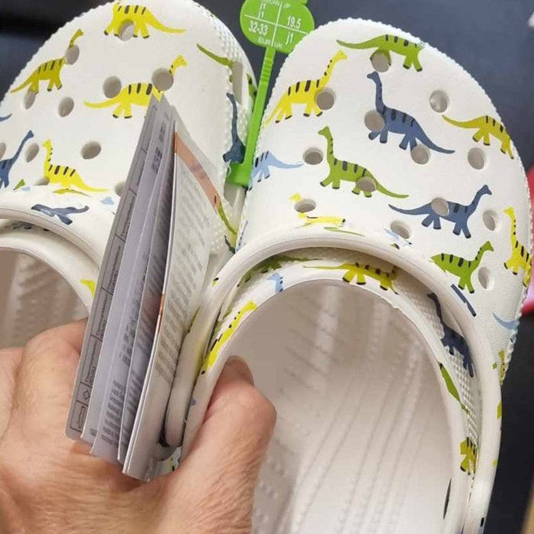 Crocs Kids - Classic Character Print Clog Dinosaur Youths, comfy white clogs with bright dino and unicorn prints, secure heel strap, and cushy soles.  ksnz