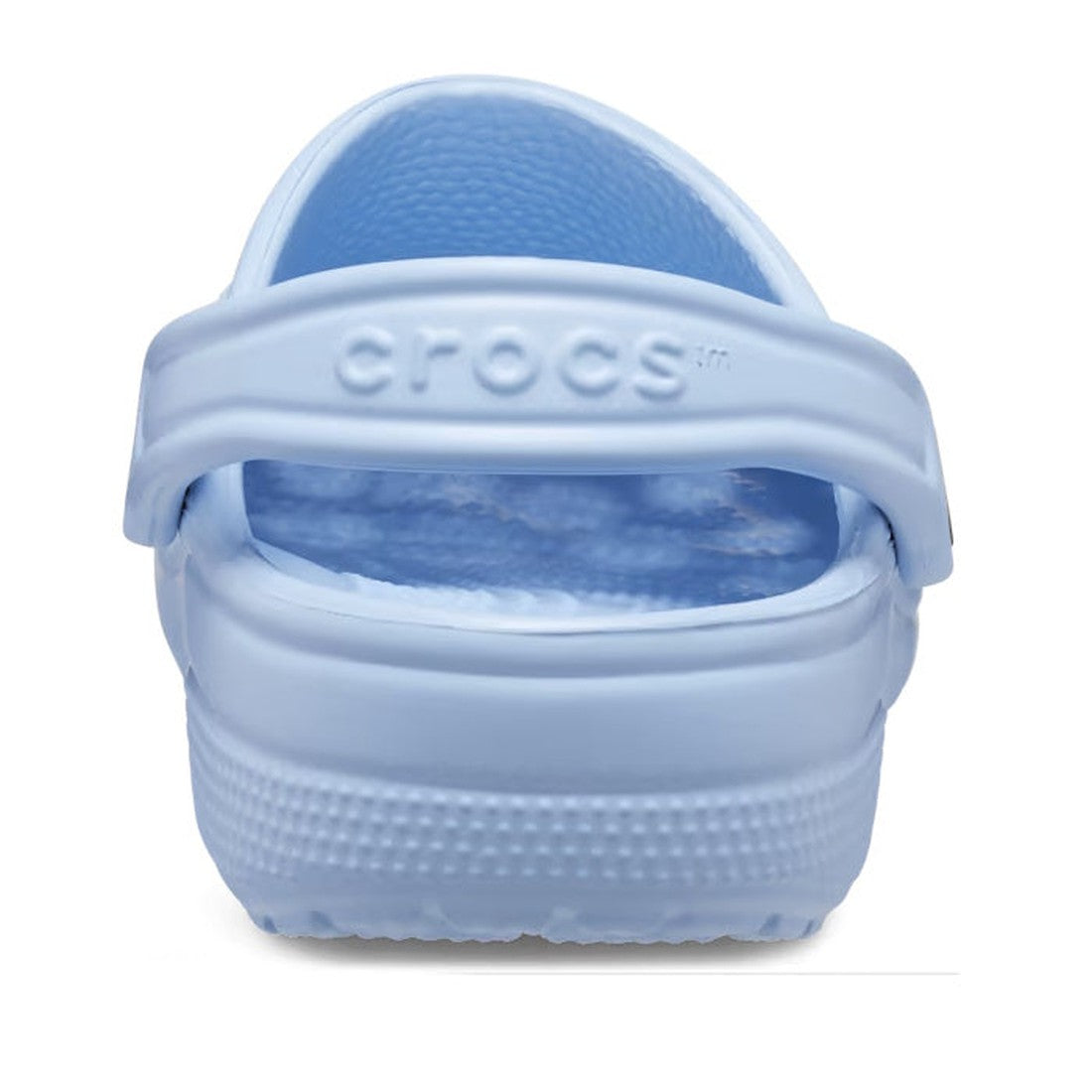 A close-up rear view of the Crocs - Classic Clog Blue Calcite Adults shows the embossed heel strap and textured sole, with its light blue shade reminiscent of soothing Blue Calcite tones., 196265406951, 196265406968, 196265406975, 196265406982, 1962654069