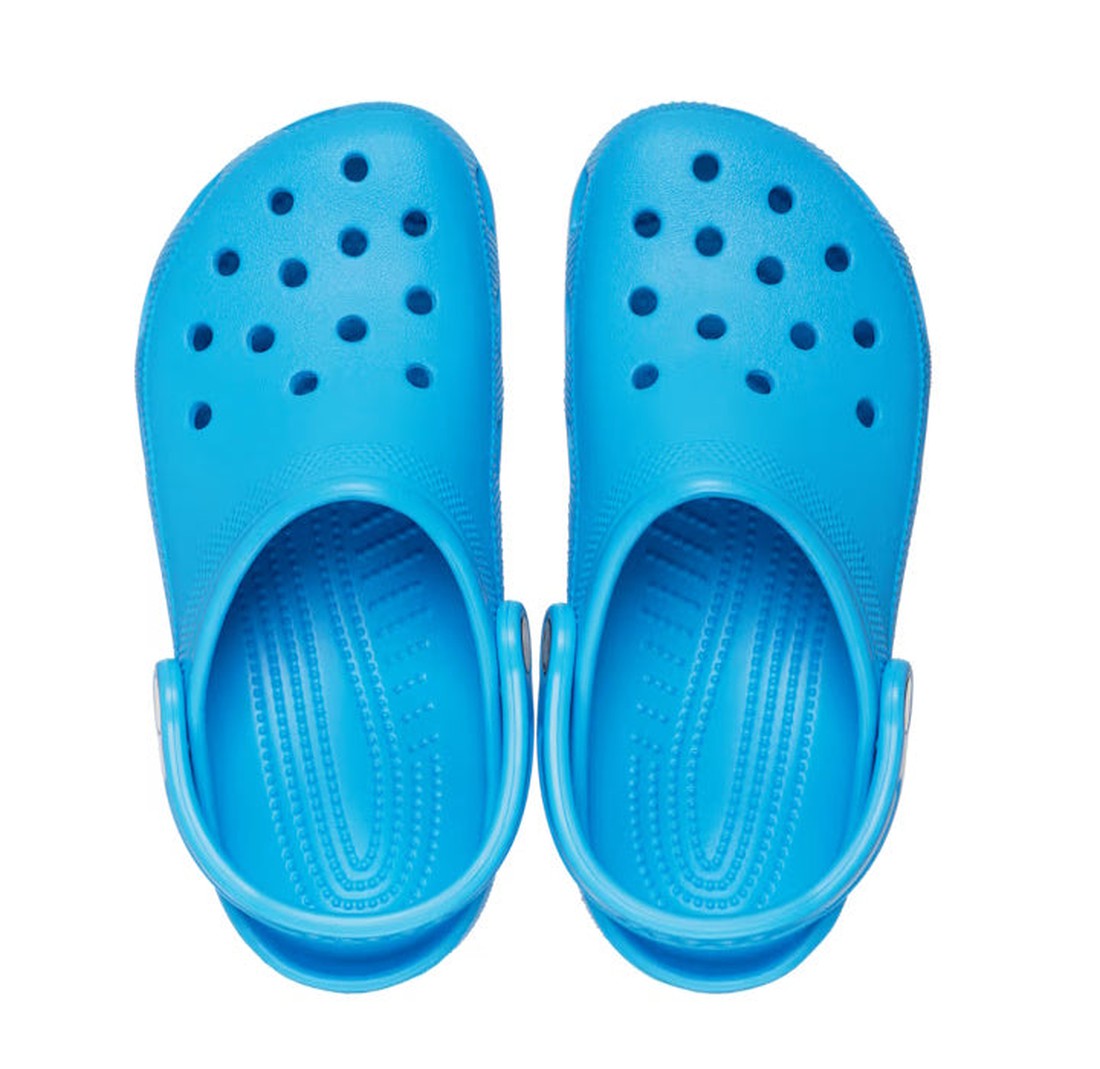 A pair of Crocs - Classic Clog Venetian Blue Adults, unisex slip-ons with ventilation holes and ankle straps, shown from above on a white background., 196265799879, 196265799886, 196265799893, 196265799909, 196265799916, 196265799923, 196265799794, 39527,