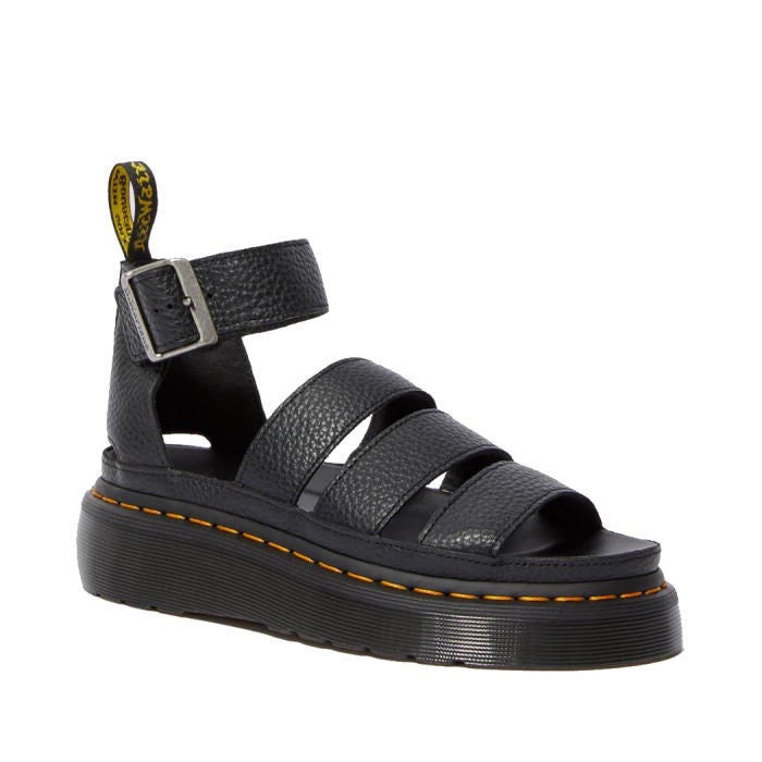 Dr Martens Clarissa II Quad Platform Sandal in black, featuring three thick straps, an adjustable buckled ankle strap, and yellow stitching around the milled Nappa leather sole.