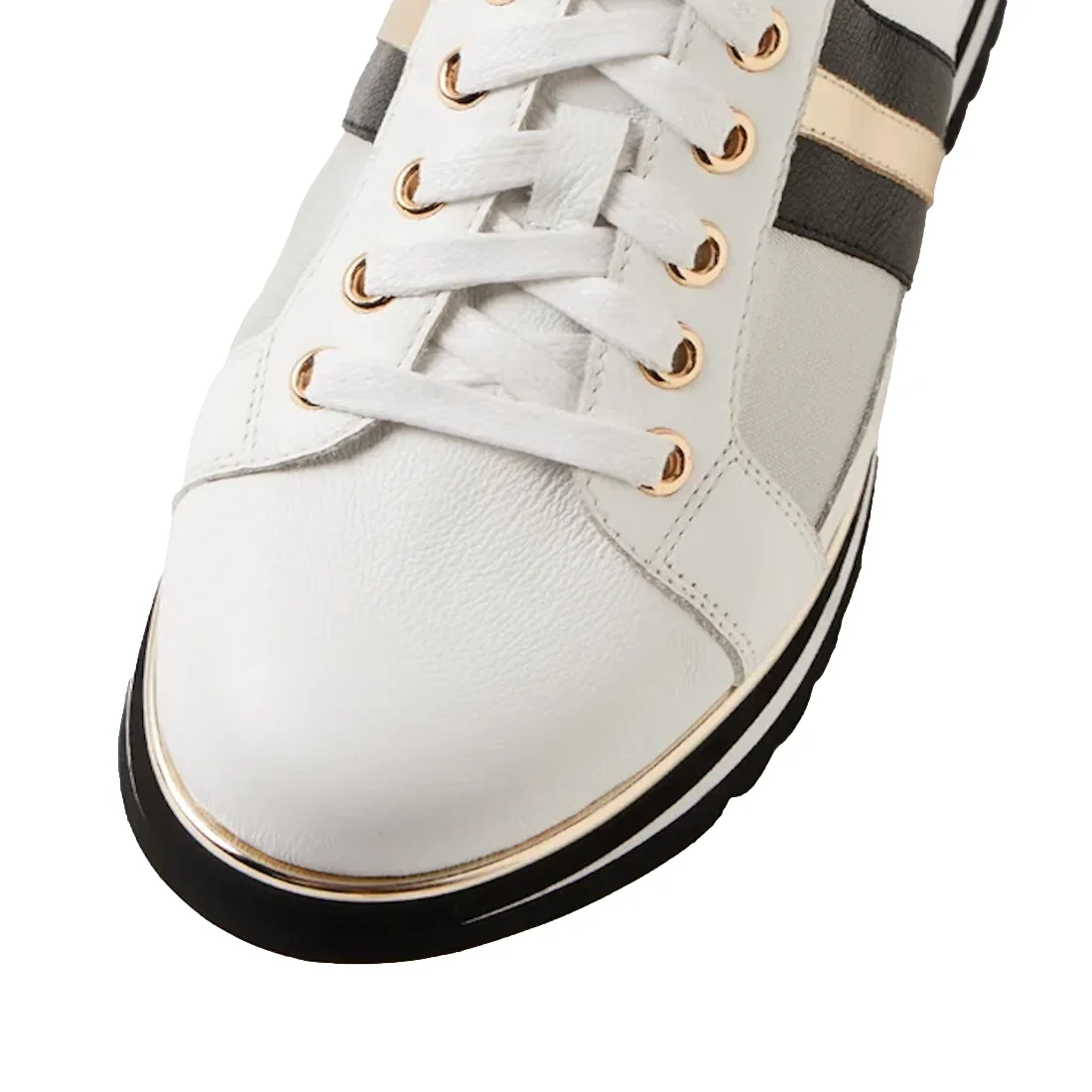 A close-up of the Django & Juliette Eminta Platform Shoe features sheer leather panels, gold eyelets, black and gold side stripes, white laces, and a black-and-white sole.
