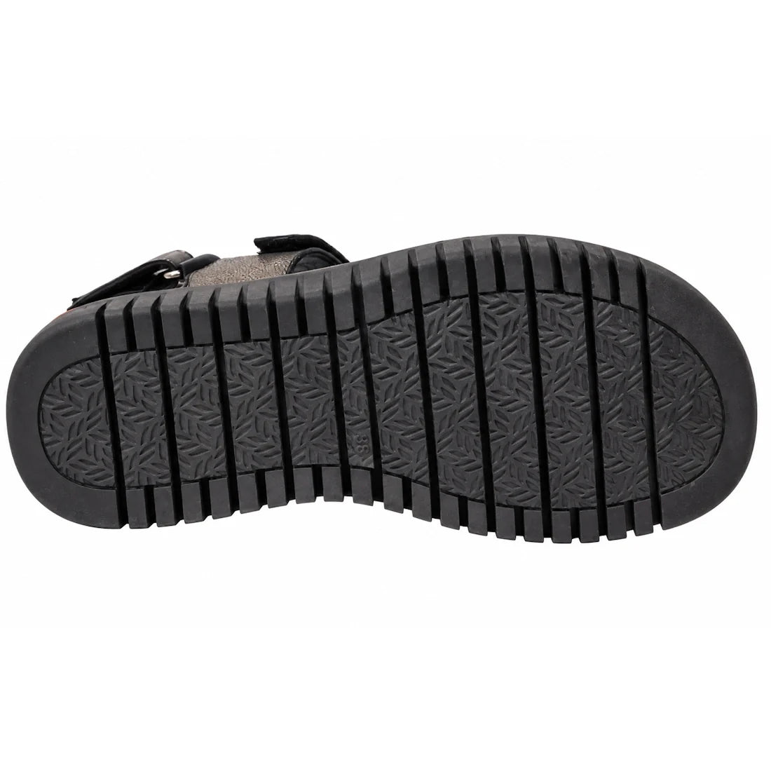 The image shows the black rubber sole of the Django & Juliette Inbar Womens Black Sandal w/Back Strap, featuring deep horizontal grooves and a subtle triangular patterned texture in the center.
