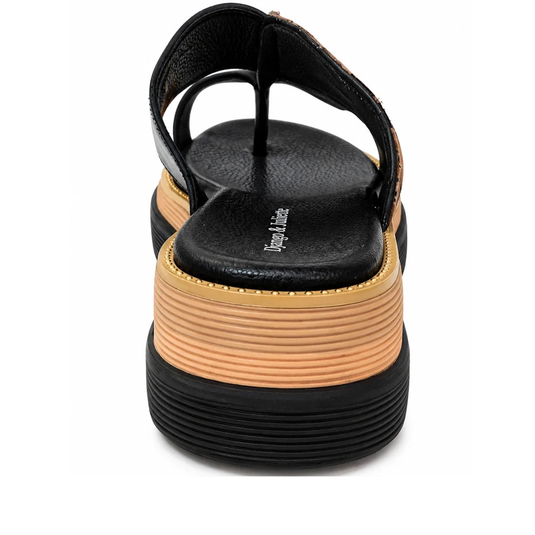 A close-up rear view of the Django & Juliette Shuua Platform Flip Flop Black Tan Zebra, featuring a thick striped platform sole in tan and black and a visible logo on the black insole.
