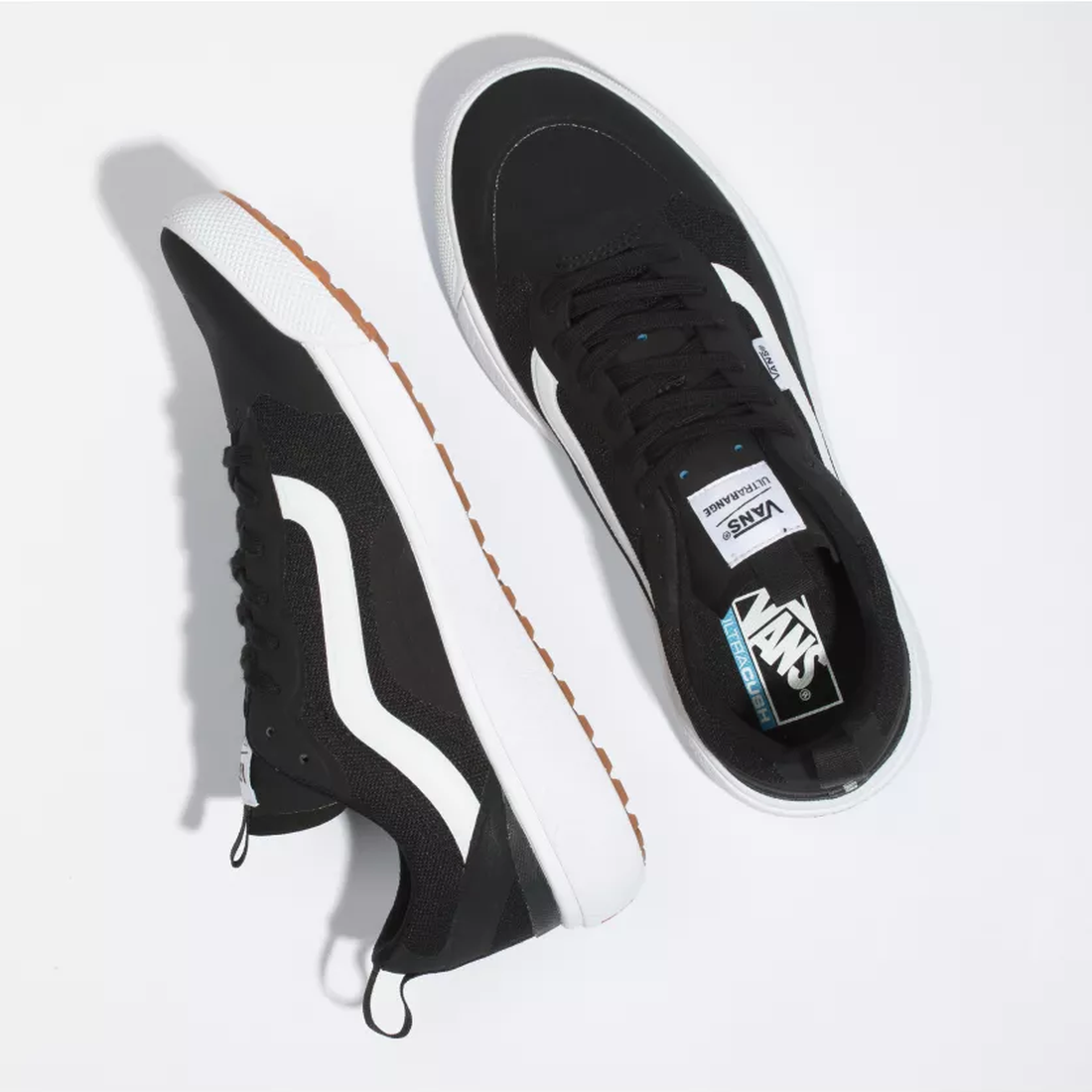 Vans Ultrarange Exo sneakers for adults in black and white, with signature stripes, grippy gum soles, and easy lace-up closure.  ksnz