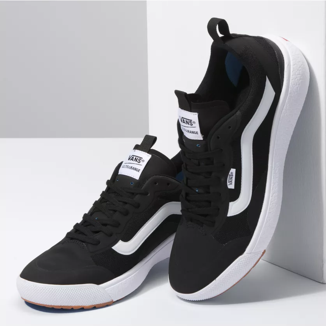 Vans Ultrarange Exo sneakers for adults in black and white, with comfy white soles, lace closure, and iconic side stripes.  ksnz