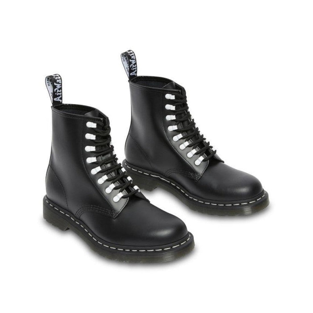 A pair of Dr Martens 1460 Disrupt Hardware 8 eye Boot Black White with thick soles, white laces, and branded pull tabs is set against a white background., 22281, 22292, 22293, 190665448887, 190665448894, 190665448917, 190665448924, 190665448931