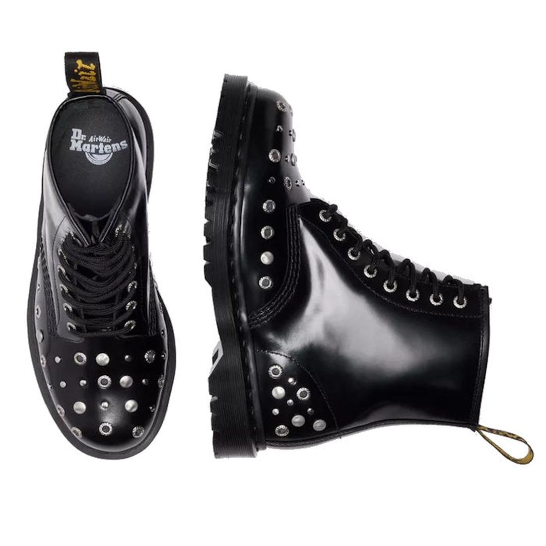 Two Dr Martens 1460 Hardware HDW Buttero Leather Boots in black, each with shiny leather and silver studs on the toe, sides, and heel. One boot is top-viewed; one from the side. Both feature black laces and yellow pull tabs at the back., 49862, 1906657975