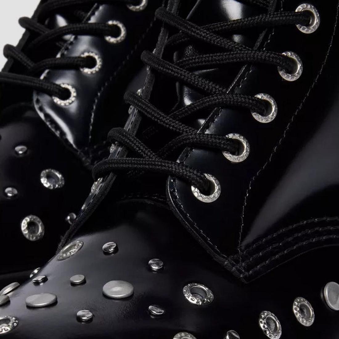 Close-up of Dr Martens 1460 Hardware HDW Buttero Leather Boot Black, featuring shiny black Buttero leather with silver studs, grommets, metal eyelets, and black laces—Goodyear welted for a bold, edgy statement., 49862, 190665797572, 190665797589, 19066579