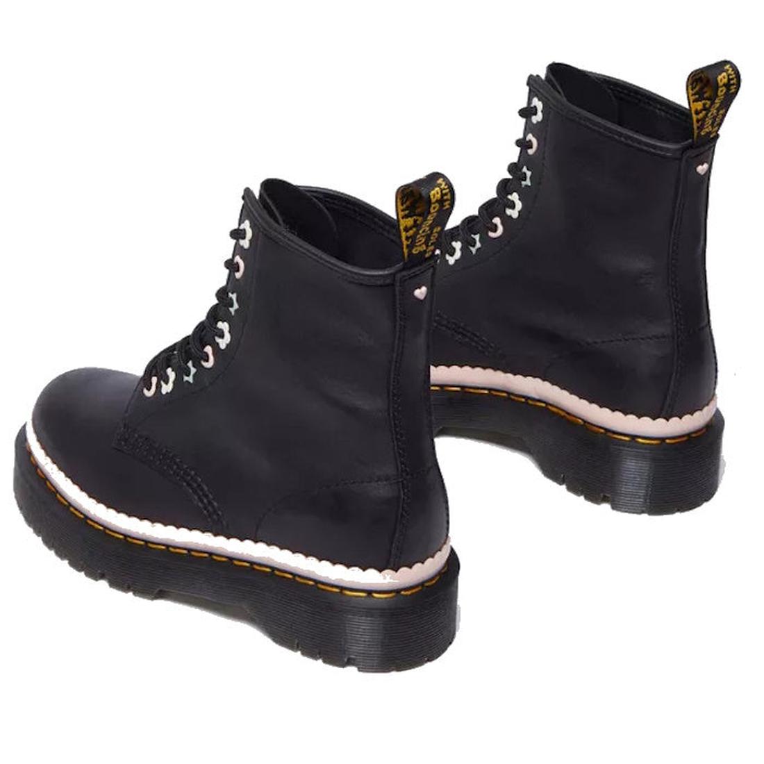 A pair of Dr Martens 1460 Bex Pascal Front Zip boots in black Nappa Luxe leather, featuring thick soles, yellow stitching, white scalloped trim, and black pull tabs with yellow text on the back.
