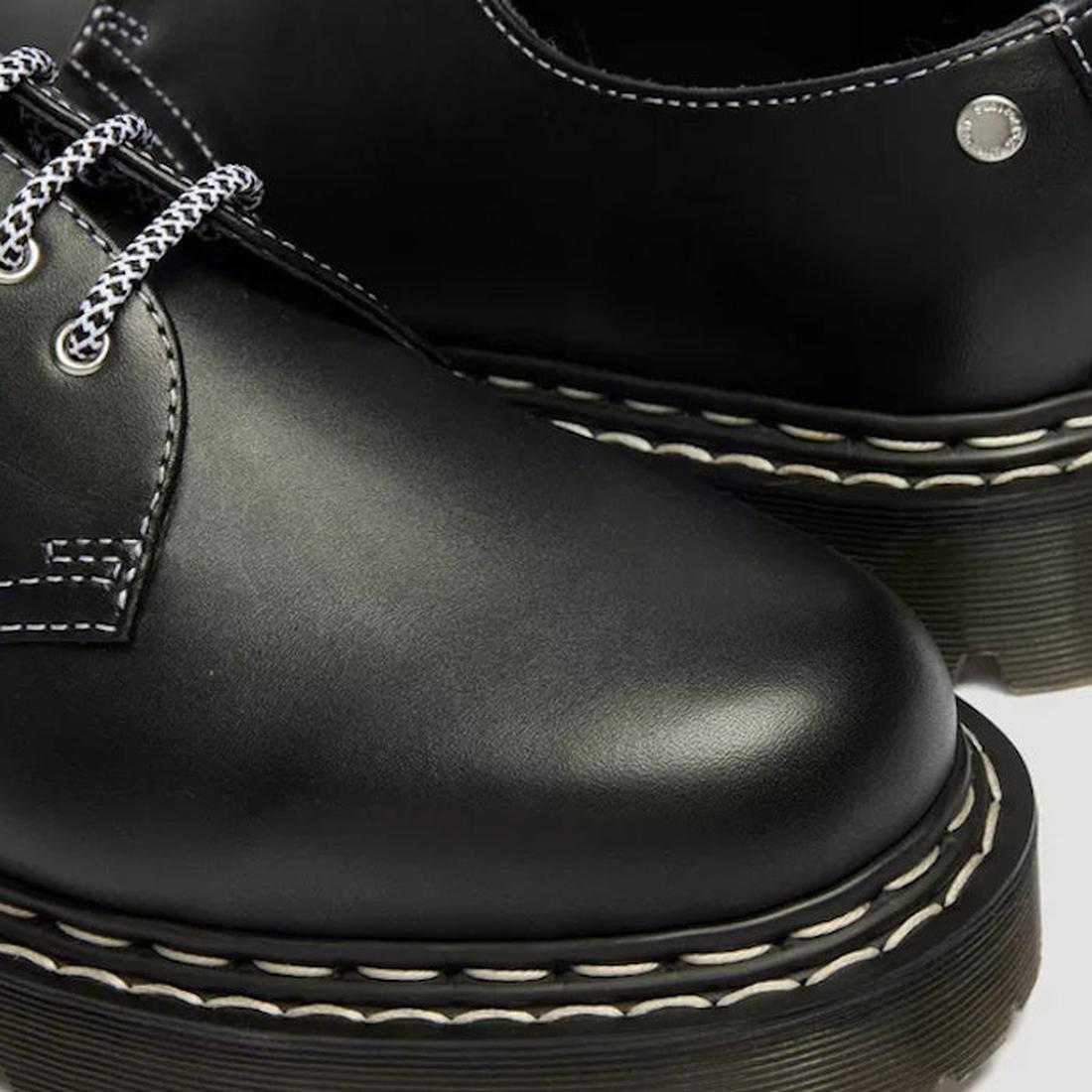 Close-up of the Dr Martens 1461 Bex WDS White Stitching Black Sendal Oxford Shoe, featuring a Bex platform sole, white stitching, black-and-white laces, polished black Sendal leather, and a metal rivet by the collar., 50357, 190665781496, 190665781502, 19