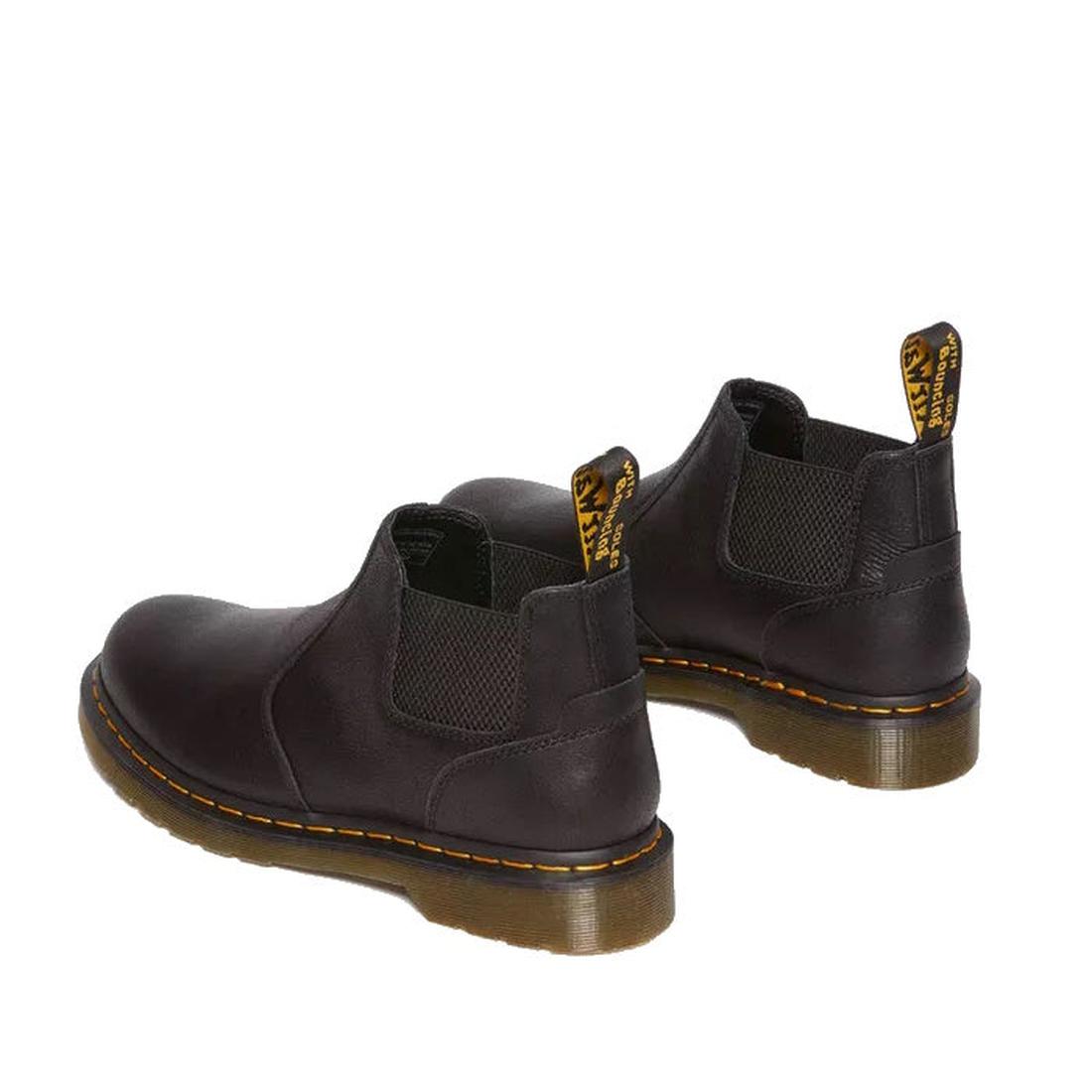 A rear heel shot of a paire of Dr Martens Crop chelsea boots in black leather showing small elastic gussets on both inner and outer of the feet and classic airwair pull tab.,
190665701937,
190665701944,
190665701968,
190665701975,
190665701982,
1906657020