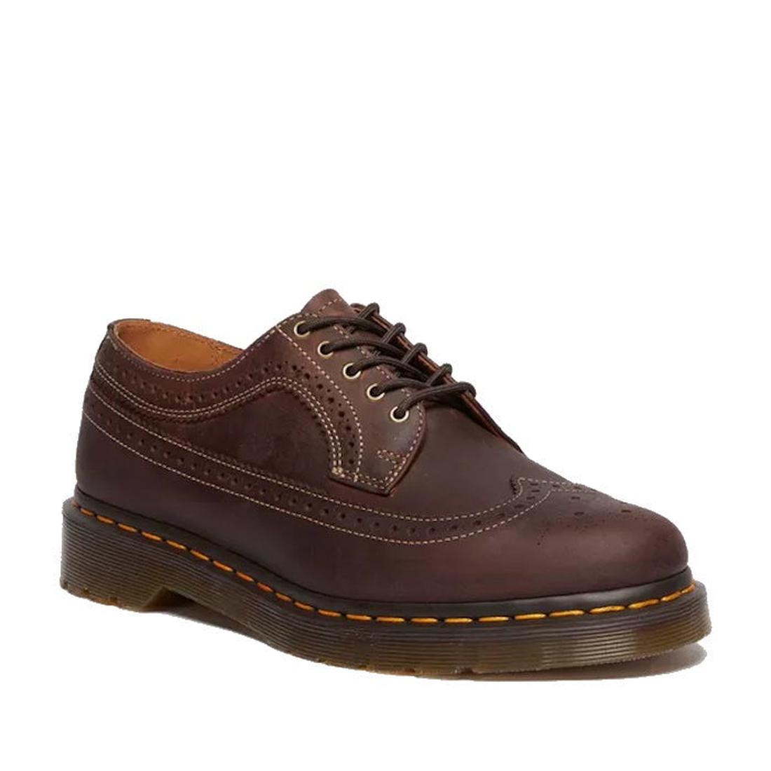 The Dr Martens - 3989 Brogue Shoes Crazy Horse Leather is displayed against a white background, featuring brown leather, decorative perforations, yellow stitching on the Goodyear Welted sole, and brown laces.