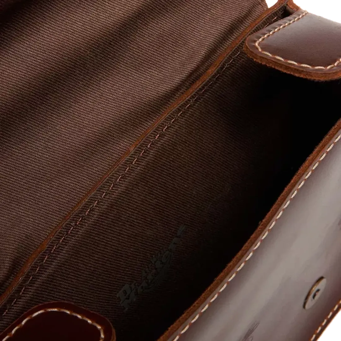 Take a peek inside the Dr Martens Amber Tan Cross Body Satchel—durable leather, sturdy stitching, secure buckle, and comfy strap.  ksnz, 190665799613