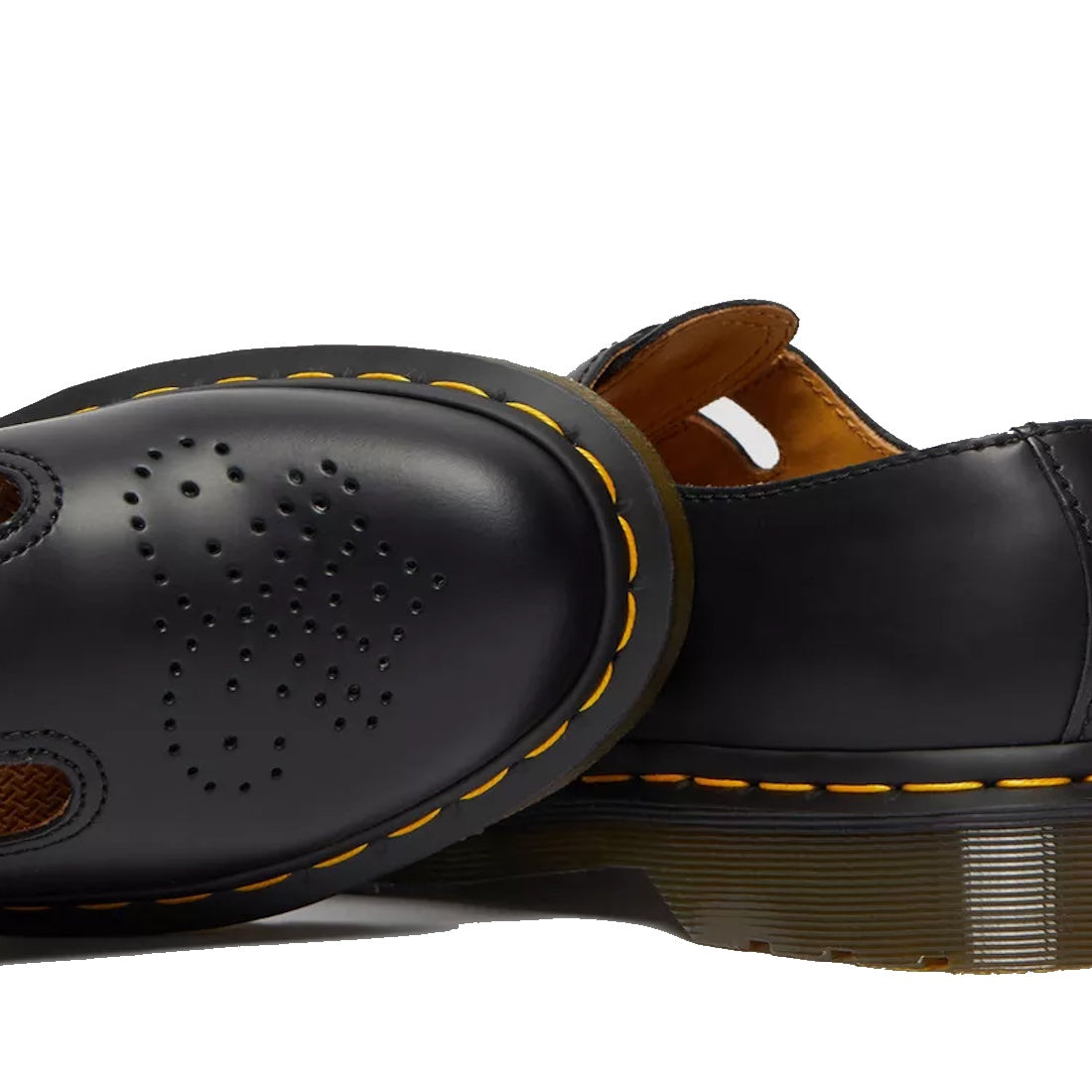 Close-up of Dr Martens 8065 2 Strap Mary Jane Shoe Black Smooth, featuring yellow stitching, perforated details, and smooth leather, highlighting the heel and sole against a white background., 883985051768, 883985051775, 883985051782, 883985051799, 883985