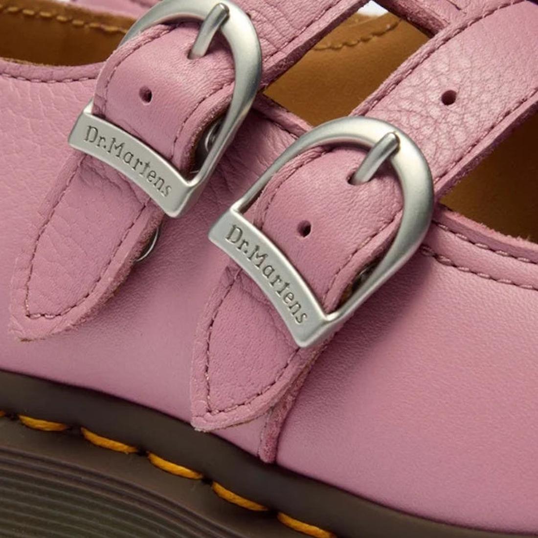 Close-up of Dr Martens 8065 2 Strap Mary Jane Shoe in Dusky Rose Pink, featuring two silver buckles with engraved logos and visible stitching on the textured leather upper., 50241, 50242, 50243, 50244, 50245, 50246, 50247, 50241, 190665781861, 19066578187
